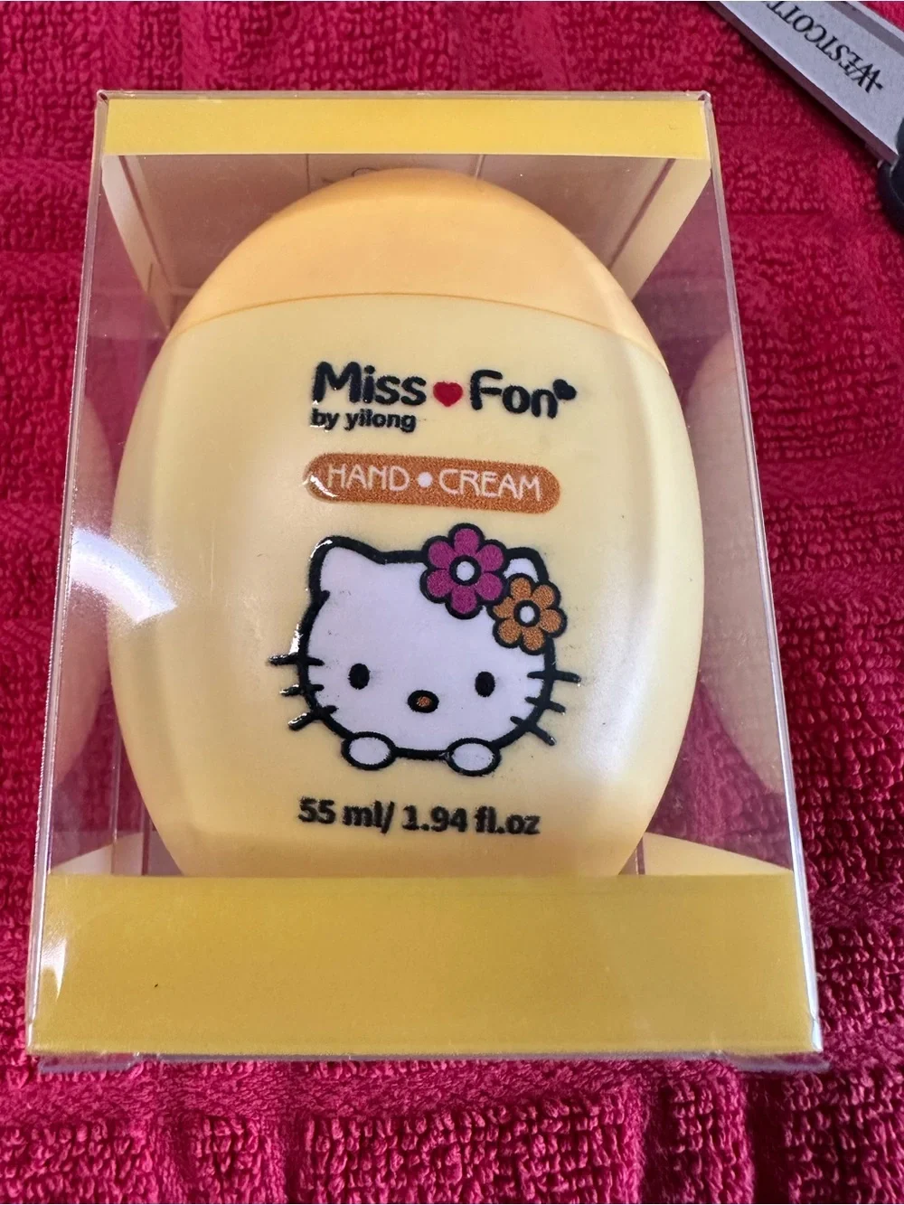 Hello Kitty Yellow Hand Cream with Pink and Orange Flower Accents